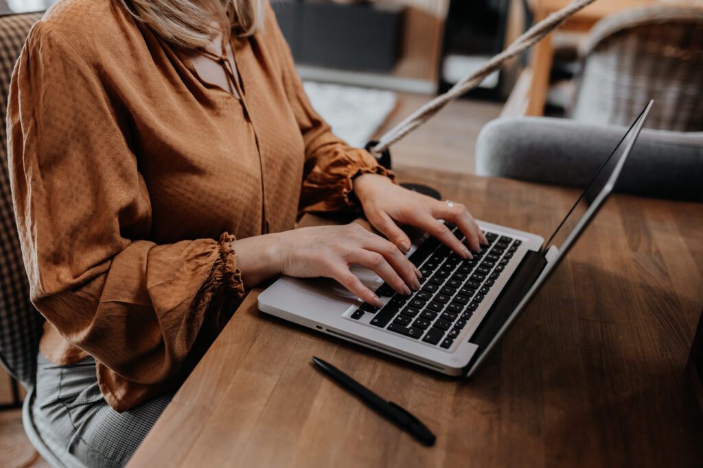 businesswoman sitting chair managing her business via home office