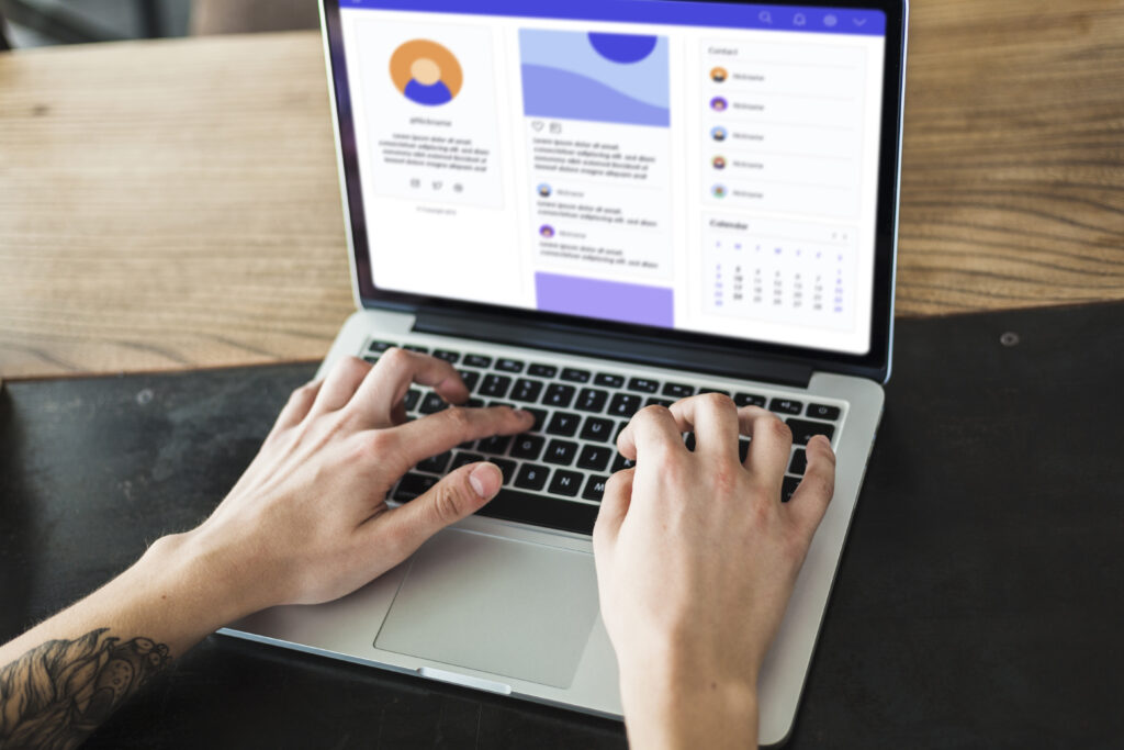 person using laptop table